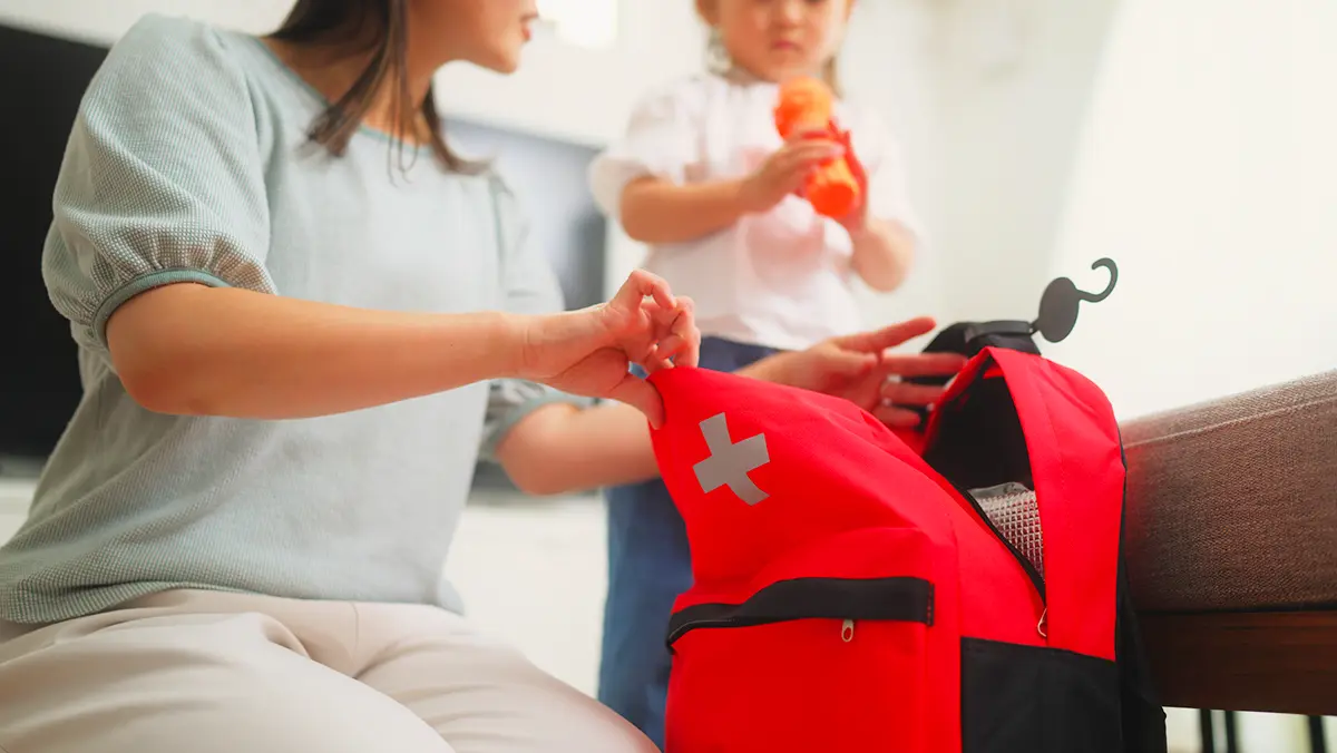 Woman packs emergency kit